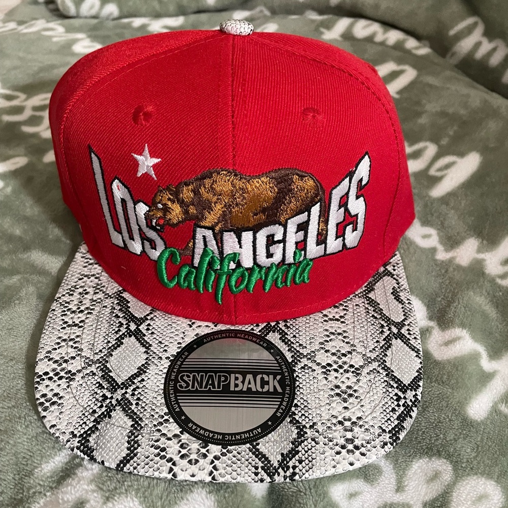 Red Snapback Cap with Snake Print Brim